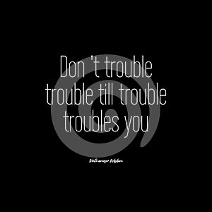 Vietnamese wisdom\'s quote on black background - Don\'t trouble trouble until trouble troubles you