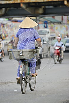 Vietnamese woman on a bike