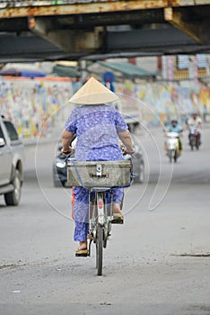 Vietnamese woman on a bike