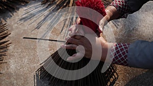 Vietnamese woman puts newly made incense sticks for drying in the sun before being packed and sent to stores. Production