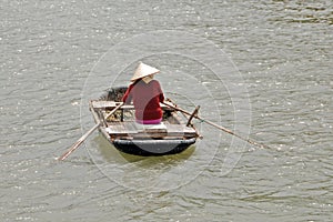 Vietnamese woman rowing