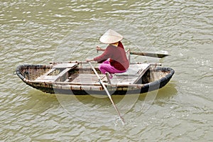 Vietnamese woman rowing