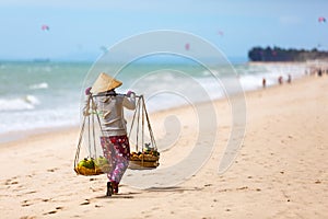 Vietnamese woman selling Fruits at Mui Ne beach. Vietnam