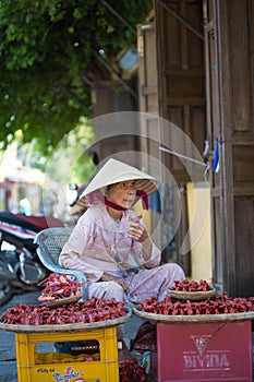 Vietnamese woman selling souvenirs in Hoi An