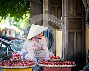 Vietnamese woman selling souvenirs in Hoi An