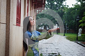 Vietnamese women wear Ao dai in the rain photo