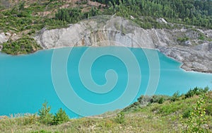 View of an abandoned chalk quarry with azure water photo