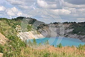 View of an abandoned chalk quarry with azure water photo