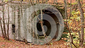 View of abandoned and closed and ruined entrance into tunnel of mine where Uranius was being mined. Lermontov city and