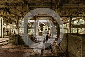 View of abandoned empty buildings of old tin mine. Industrial dirty building interior. Damaged factory in Rolava, Ore mountains,