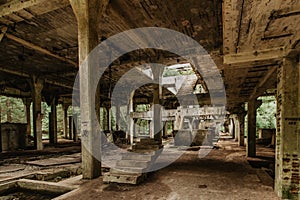 View of abandoned empty buildings of old tin mine. Industrial dirty building interior. Damaged factory in Rolava, Ore mountains,