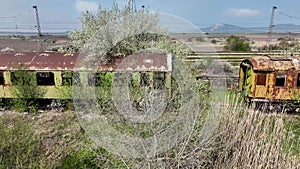 View of abandoned old railway wagons at station. Old train wagons