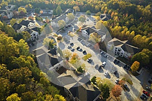 View from above of apartment residential condos between yellow fall trees in suburban area in South Carolina. American