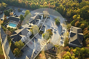 View from above of apartment residential condos between yellow fall trees in suburban area in South Carolina. American
