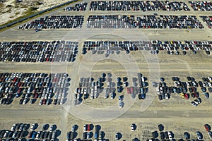 View from above of big parking lot with parked used cars after accident ready for sale. Auction reseller company selling