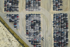 View from above of big parking lot with parked used cars after accident ready for sale. Auction reseller company selling