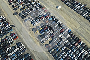 View from above of big parking lot with parked used cars after accident ready for sale. Auction reseller company selling