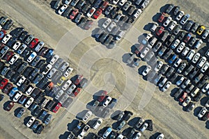 View from above of big parking lot with parked used cars after accident ready for sale. Auction reseller company selling