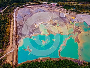 Blue waters of the former tailing dump in the village of Kavalerovo.