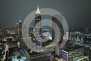 View from above of brightly illuminated high skyscraper buildings in downtown district of Atlanta city in Georgia, USA