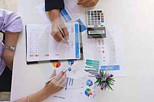 View from above.Business people meeting to analyze and discuss the situation on the financial report in meeting room.