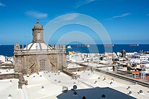 Town with part of the Santa Ana Cathedral, sea and freighter in Las Palmas on Gran Canaria, Spain