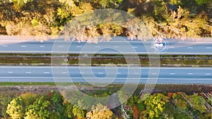 View from above of cars on autopilot self-driving on busy american highway with fast moving autonomous traffic between