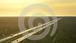 View from above of crowded american I-75 expressway in Florida with fast moving traffic at sunrise. Fast interstate