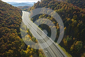 View from above of empty deserted I-40 freeway route in North Carolina leading to Asheville thru Appalachian mountains