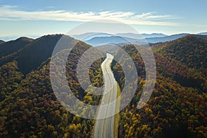 View from above of empty deserted I-40 freeway route in North Carolina leading to Asheville thru Appalachian mountains