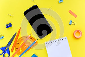 View from above. Flat lay. Mock up blank screen mobile phone for back to school background concept