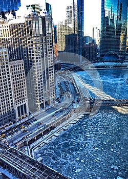 View from above of frozen Chicago River and reflective lights.