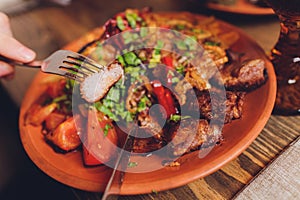 View from above of georgian cuisine on brown wooden table.Traditional georgian food-khinkali,kharcho,chahokhbili,phali photo