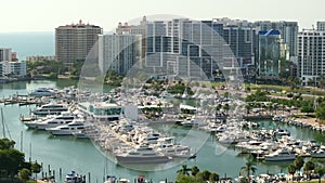 View from above of high-rise buildings in downtown of Sarasota city in Florida, USA. Bay marina wint many expensive