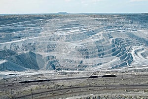view from above of a huge asbestos quarry, the mined-out slopes