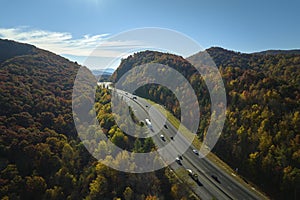 View from above of I-40 freeway in North Carolina heading to Asheville through Appalachian mountains in golden fall