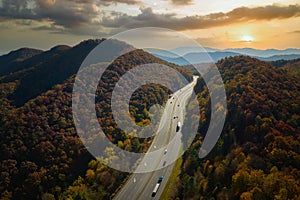 View from above of I-40 freeway in North Carolina heading to Asheville through Appalachian mountains in golden fall