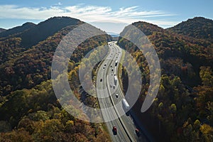 View from above of I-40 freeway in North Carolina heading to Asheville through Appalachian mountains in golden fall