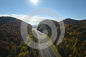 View from above of I-40 freeway route in North Carolina leading to Asheville thru Appalachian mountains with yellow fall