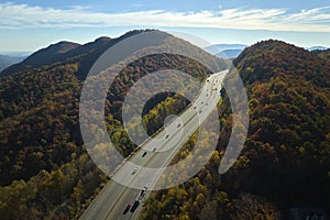 View from above of I-40 freeway route in North Carolina leading to Asheville thru Appalachian mountains with yellow fall