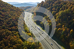 View from above of I-40 freeway route in North Carolina leading to Asheville thru Appalachian mountains with yellow fall