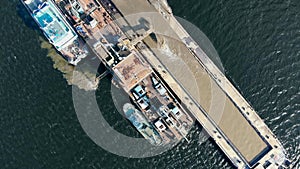 View from above on the industrial barge excavating sand