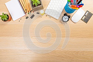 View from above.Laptop,pen,tablet,smart phone and cup of coffee on white office desk with copy space