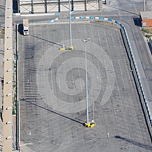 View from Above of a Large Truck Parking lot almost completely Empty and with only one Truck