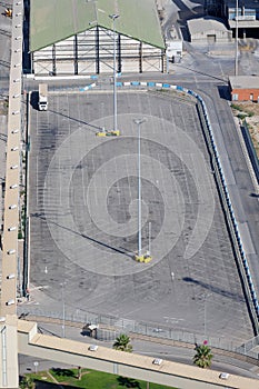 View from Above of a Large Truck Parking lot almost completely Empty and with only one Truck