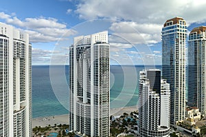 View from above of luxurious highrise hotels and condos on Atlantic ocean shore in Sunny Isles Beach city. American