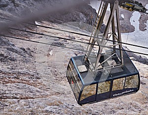 View from above onto the cable car of the glacier cableway, which transports passengers to the glacier station below the summit of