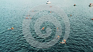 View from above of an open water swimming event