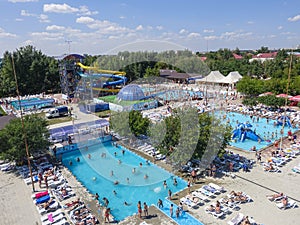 View from above on outdoors swimming pools in water park.