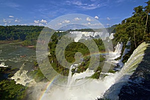 View from above of rainbow across Iguazu falls in Argentina